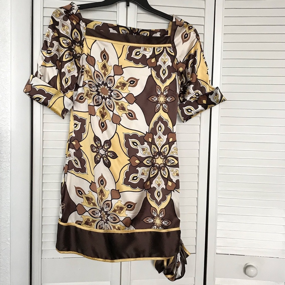 Short dress with small bow on a side .